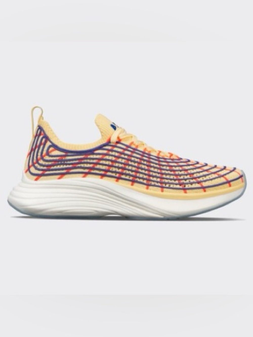 Light Yellow Knit Running Shoe with Purple & Orange Accents